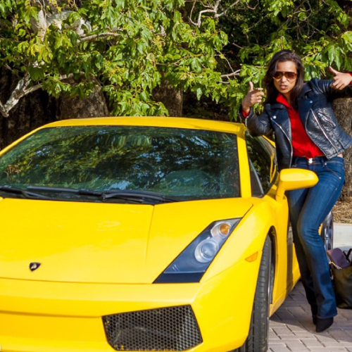 Picture of Valenzia Algarin and her yellow Lamborghini.